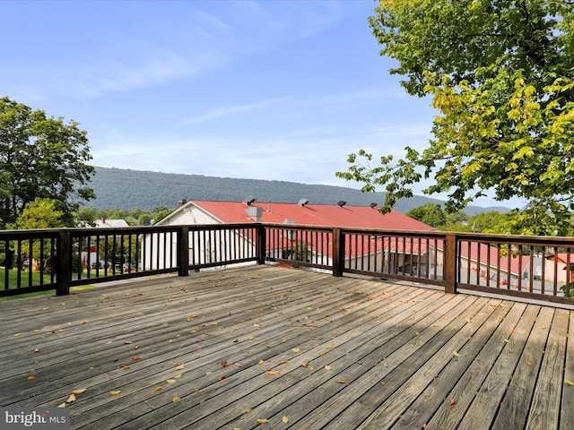 wooden terrace with a mountain view