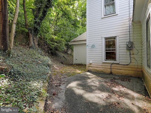 view of side of property featuring a patio