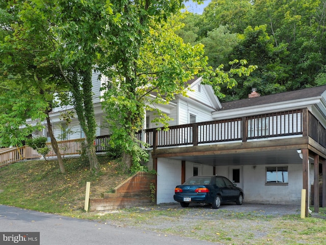 view of property exterior with a carport