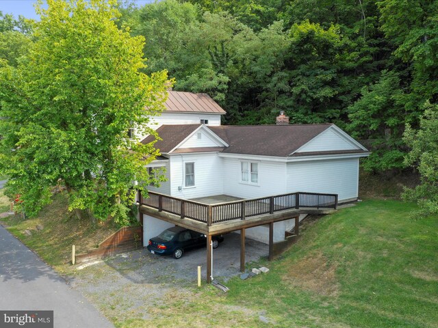 exterior space with a lawn and a deck