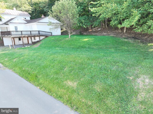 view of yard with a wooden deck