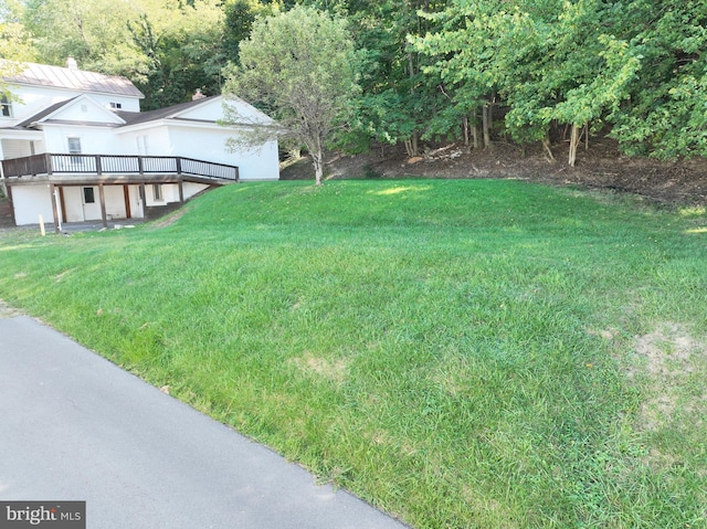 view of yard featuring a wooden deck