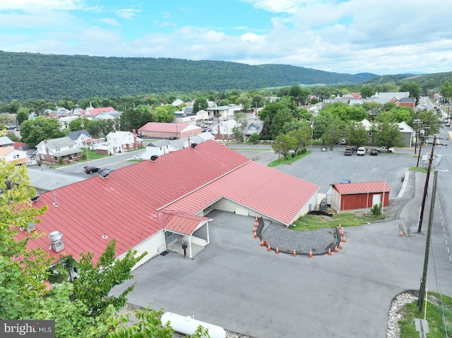 birds eye view of property with a mountain view