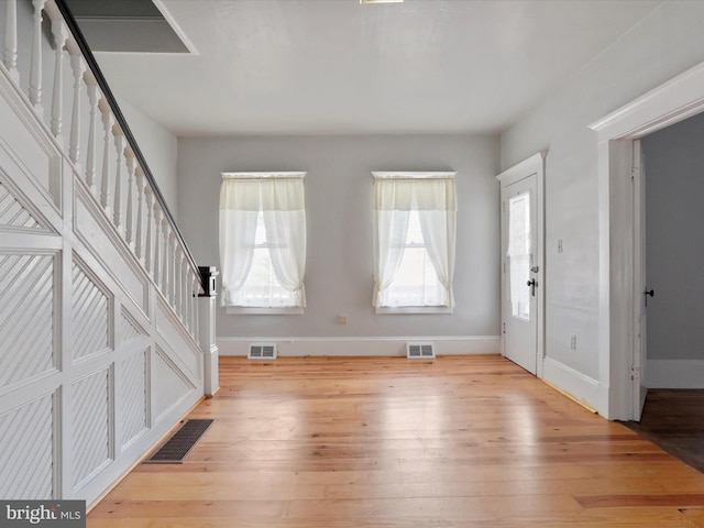 entrance foyer with light hardwood / wood-style flooring