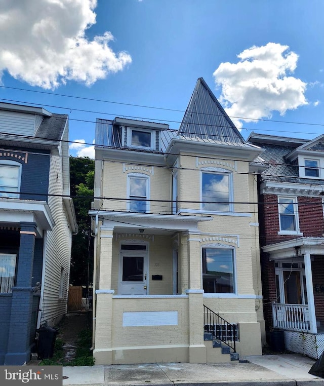 townhome / multi-family property featuring brick siding