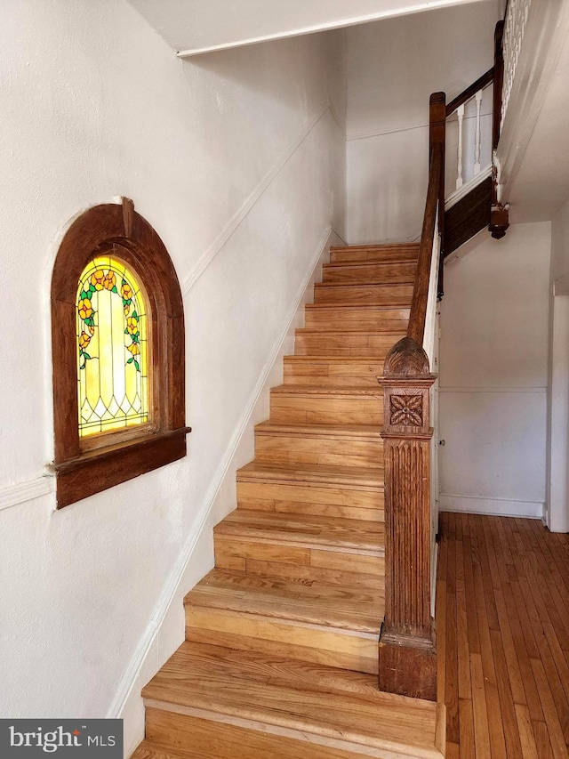 staircase featuring hardwood / wood-style floors