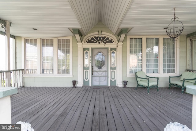 wooden terrace with a porch