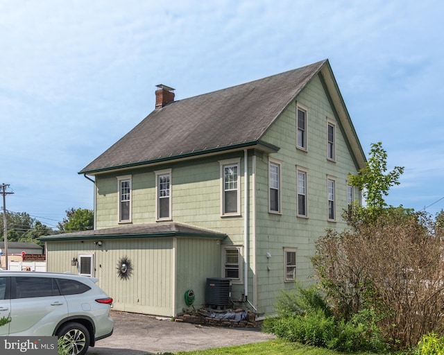 view of home's exterior with central AC