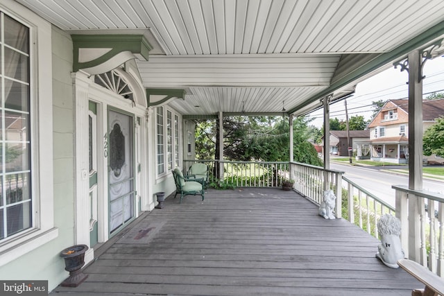 wooden deck featuring covered porch