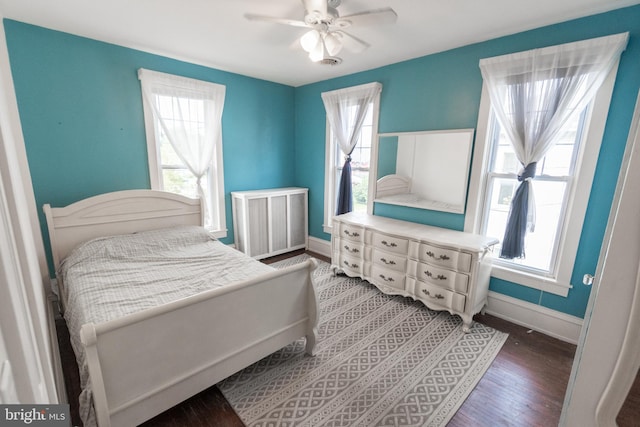 bedroom featuring dark wood-type flooring and ceiling fan