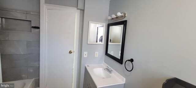 bathroom featuring vanity and separate shower and tub