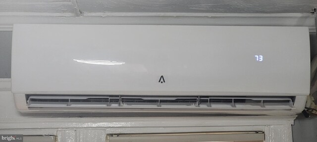 details featuring a wall mounted air conditioner