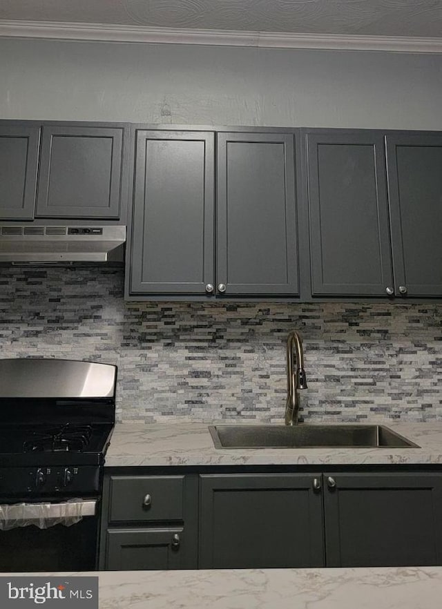 kitchen featuring gray cabinets, sink, black range with gas cooktop, and extractor fan