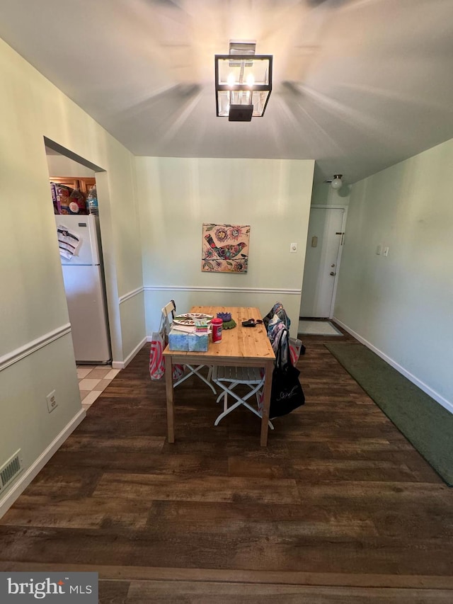 dining area with hardwood / wood-style flooring