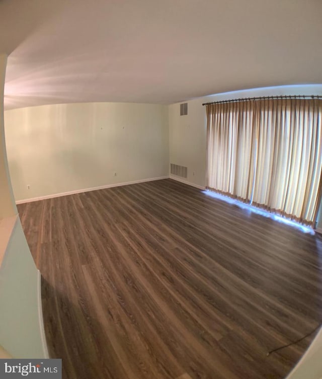 empty room featuring hardwood / wood-style floors