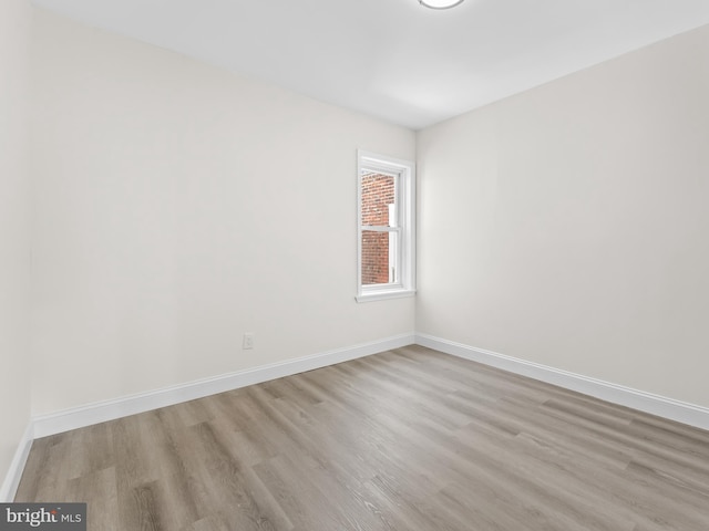 spare room featuring light hardwood / wood-style floors