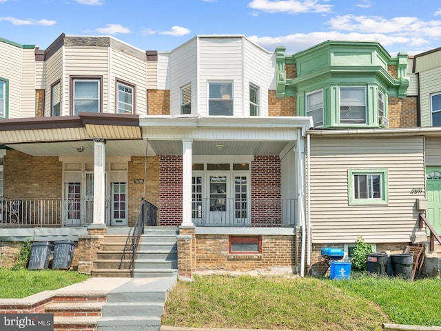 multi unit property featuring a porch