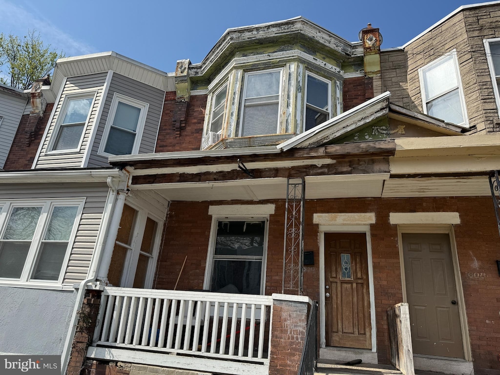 1610 S Ithan St, Philadelphia, PA 19143 - view of front of house with brick siding and a porch