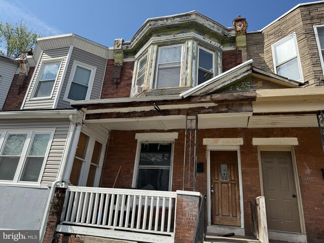 1610 S Ithan St, Philadelphia, PA 19143 - view of front of house with brick siding and a porch