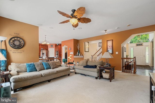 living room featuring ceiling fan and light carpet