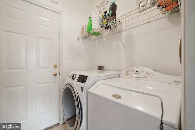 washroom with washer and clothes dryer