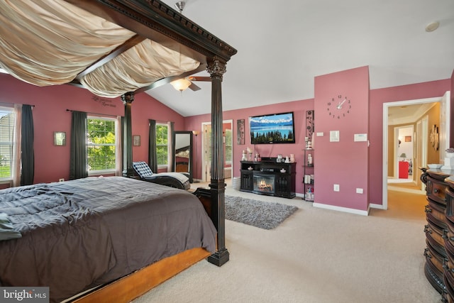 carpeted bedroom featuring ceiling fan and vaulted ceiling