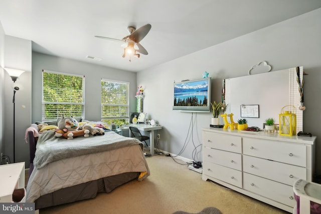 bedroom with ceiling fan and light colored carpet