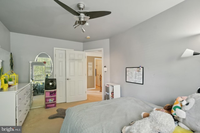 carpeted bedroom featuring ceiling fan