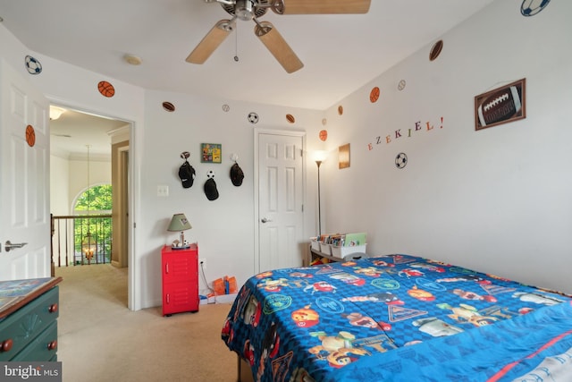 bedroom featuring light colored carpet and ceiling fan