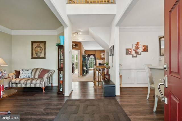 entryway featuring crown molding and dark hardwood / wood-style flooring