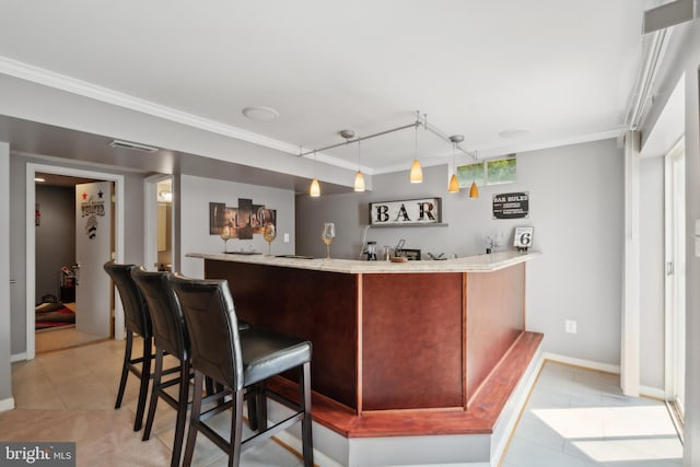 bar with light tile patterned flooring, ornamental molding, and pendant lighting