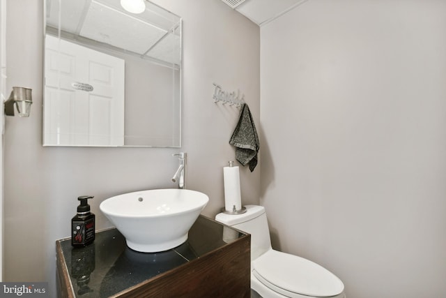 bathroom featuring toilet and sink