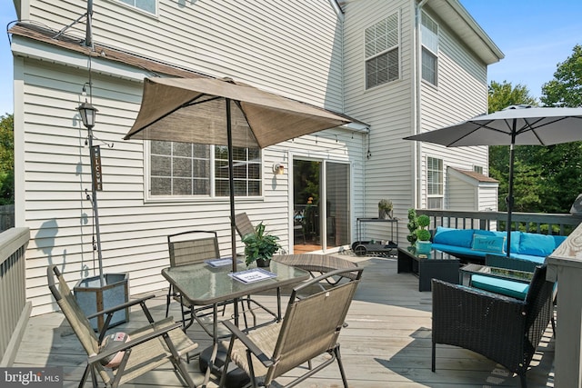 deck featuring outdoor lounge area