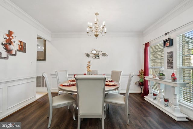 dining area with ornamental molding, an inviting chandelier, and dark hardwood / wood-style floors