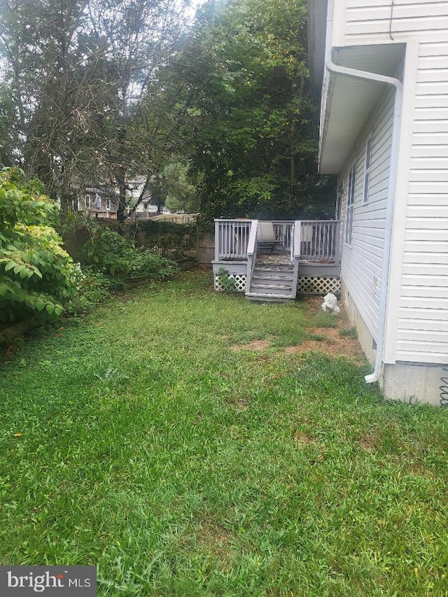 view of yard featuring a deck