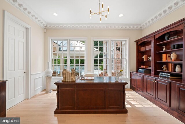 office area featuring crown molding, light hardwood / wood-style flooring, and a chandelier