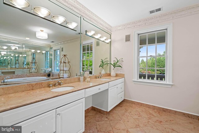 bathroom with vanity, a tub, and tile patterned floors