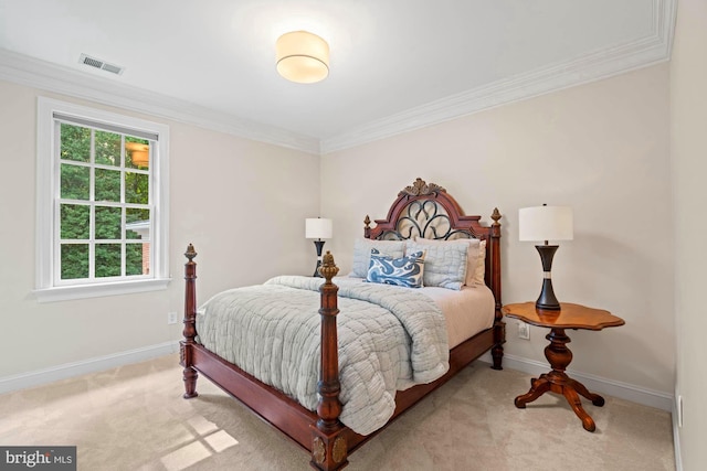 bedroom featuring ornamental molding, multiple windows, and light colored carpet