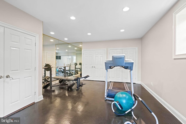 workout room with recessed lighting and baseboards