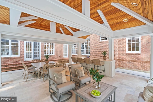 view of patio / terrace with outdoor dining area, outdoor dry bar, and a gazebo