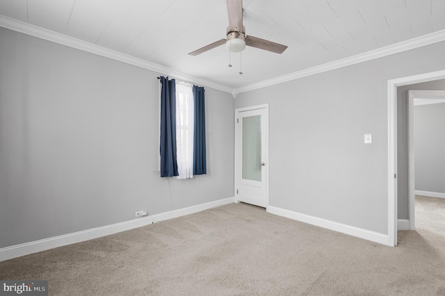 empty room with light carpet, ceiling fan, and crown molding