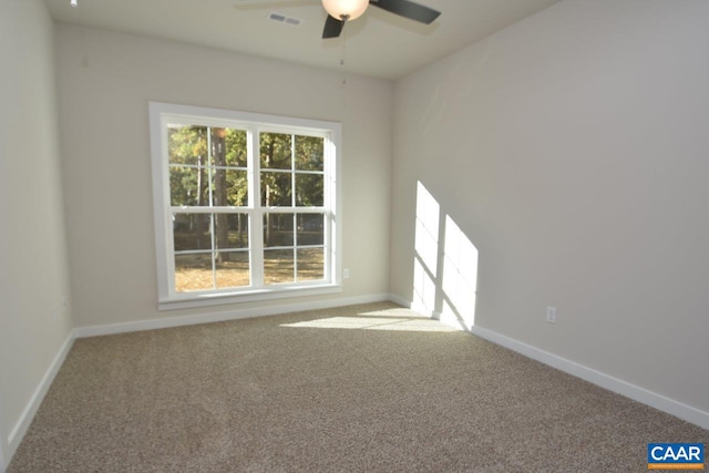 spare room with carpet floors and ceiling fan