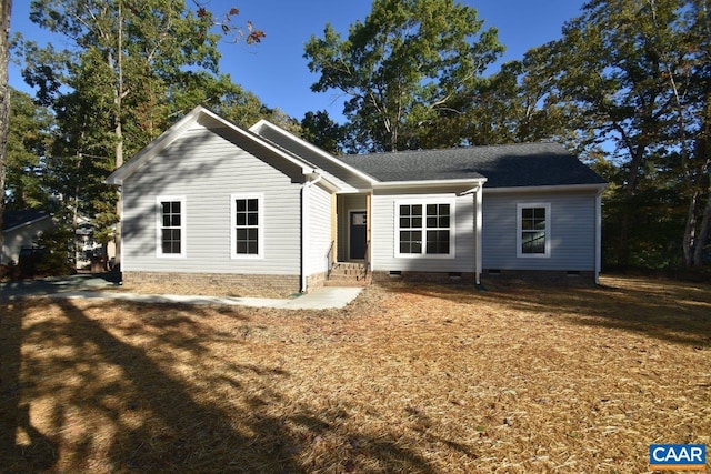 ranch-style home with a front lawn