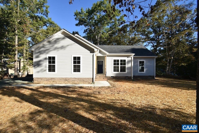 ranch-style home with a front lawn