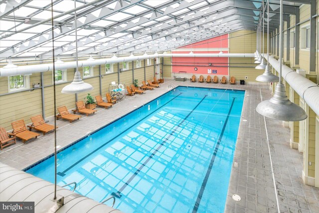 view of swimming pool featuring a water view