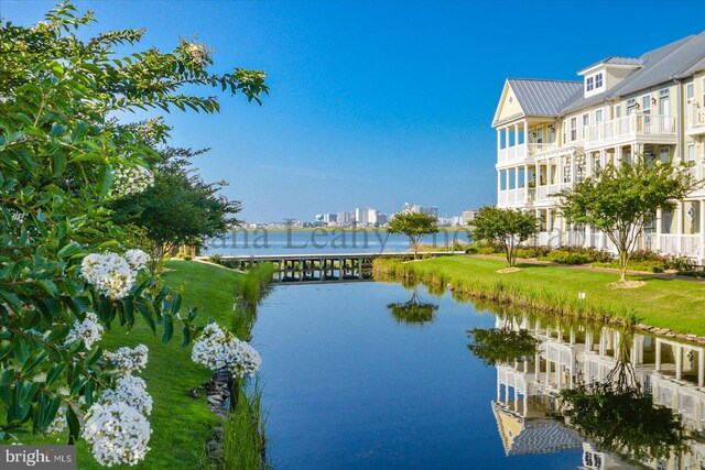 view of dock with a water view and a balcony