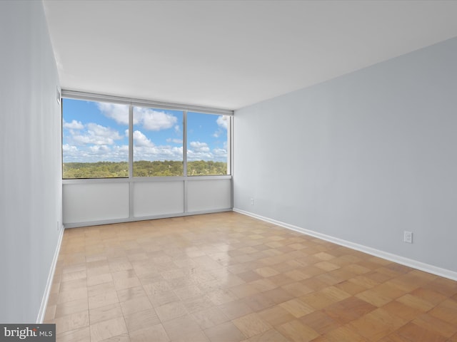 empty room featuring baseboards