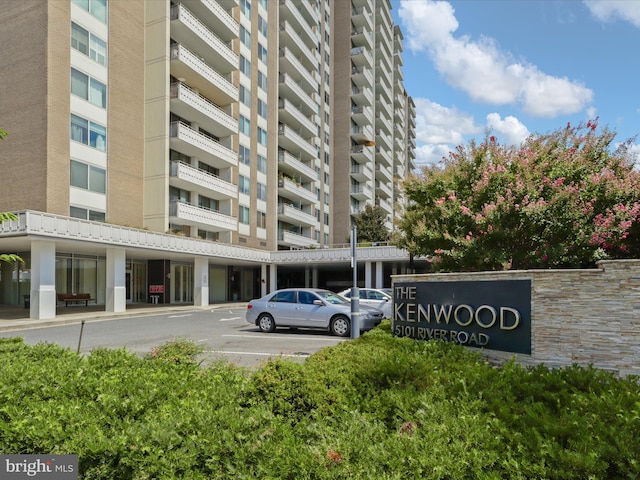 view of building exterior with uncovered parking