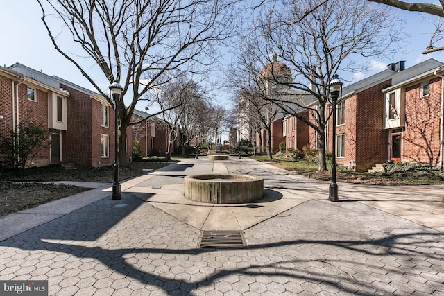 view of street with a residential view and street lighting