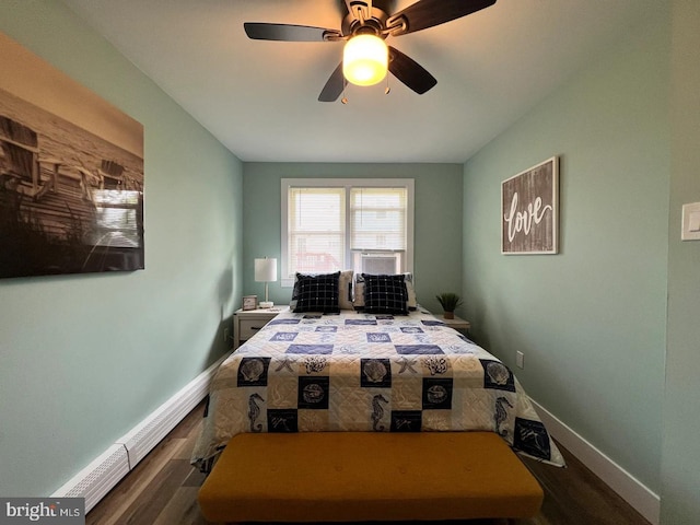 bedroom with ceiling fan, hardwood / wood-style flooring, and cooling unit